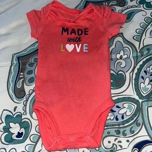 From carters, the size is newborn also 100% cotton. Its In good condition.